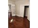 Spacious bedroom with gleaming hardwood floors and natural light at 315 Highland St, Brooksville, FL 34601