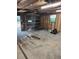 View of inside the garage with exposed studs and debris on the floor at 315 Highland St, Brooksville, FL 34601