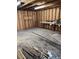 Unfinished garage space with plywood walls and concrete floor at 315 Highland St, Brooksville, FL 34601
