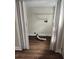 An unfinished laundry room with laminate floors, wire shelves, and exposed ductwork at 315 Highland St, Brooksville, FL 34601