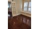 Inviting living space featuring gleaming hardwood floors and a window seat, perfect for relaxation at 315 Highland St, Brooksville, FL 34601