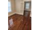 Inviting living room with pristine hardwood floors and an abundance of natural light at 315 Highland St, Brooksville, FL 34601