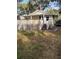 Quaint backyard features a wooden deck and stairs at 315 Highland St, Brooksville, FL 34601