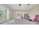 Bedroom with neutral tones, shutters, and a ceiling fan, providing a serene and restful atmosphere at 3167 Bay Ln, Clearwater, FL 33759