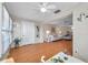 Spacious living area featuring wood floors, lots of natural light, and comfortable seating at 4266 Tamargo Dr # 4266, New Port Richey, FL 34652
