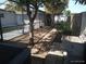 View of the backyard with trees, pavers, and partially enclosed pool at 4607 N Saint Vincent St, Tampa, FL 33614