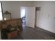 View of a bathroom doorway with framed art and a white door in a clean space at 4607 N Saint Vincent St, Tampa, FL 33614