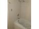Bathroom with bathtub and white tiled walls at 4607 N Saint Vincent St, Tampa, FL 33614