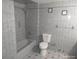 Bathroom featuring neutral tile and a shower/tub combination at 4607 N Saint Vincent St, Tampa, FL 33614