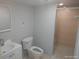 Bathroom featuring neutral wall and floor tiles with shower and vanity at 4607 N Saint Vincent St, Tampa, FL 33614