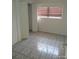 Bedroom showcasing tile flooring and closet at 4607 N Saint Vincent St, Tampa, FL 33614