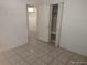 Bedroom featuring closet and door to another room at 4607 N Saint Vincent St, Tampa, FL 33614