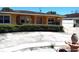Well-maintained ranch-style home with lush landscaping and a concrete driveway at 4607 N Saint Vincent St, Tampa, FL 33614
