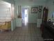 View of the tiled living room with decorations and furniture at 4607 N Saint Vincent St, Tampa, FL 33614