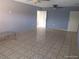 Spacious living room featuring ceiling fans and neutral wall color with tile flooring at 4607 N Saint Vincent St, Tampa, FL 33614