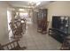 Spacious living room featuring tile flooring, dining area, and a large display cabinet at 4607 N Saint Vincent St, Tampa, FL 33614