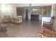 Spacious living area featuring tiled floors, classic furniture, and decorative elements at 4607 N Saint Vincent St, Tampa, FL 33614