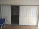 Open patio doors revealing an interior room, and natural light, on tile patio at 4607 N Saint Vincent St, Tampa, FL 33614
