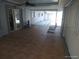 Covered patio with tile flooring, seating, and view of the swimming pool at 4607 N Saint Vincent St, Tampa, FL 33614