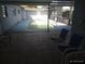 Outdoor pool with chairs is partially covered by a screen enclosure at 4607 N Saint Vincent St, Tampa, FL 33614