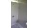 Clean tile shower in a bathroom featuring white tiles and simple fixtures at 4607 N Saint Vincent St, Tampa, FL 33614
