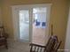 View of sliding glass doors leading to an outdoor patio with seating area at 4607 N Saint Vincent St, Tampa, FL 33614