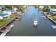 Waterfront community featuring canals and waterway access with a boat on the water at 4964 Cedarbrook Ln, Hernando Beach, FL 34607