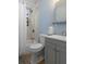 Bathroom with a shower/tub combo, updated fixtures, and a neutral color scheme at 4964 Cedarbrook Ln, Hernando Beach, FL 34607