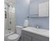 This bathroom has a shower, toilet and vanity, offering a blend of style and functionality for a comfortable experience at 4964 Cedarbrook Ln, Hernando Beach, FL 34607