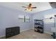 The bedroom showcases a ceiling fan, window, and neutral color palette providing a clean and relaxing atmosphere at 4964 Cedarbrook Ln, Hernando Beach, FL 34607