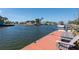 View from dock of open water, ample space for chairs, and the 'Three ' boat at 4964 Cedarbrook Ln, Hernando Beach, FL 34607