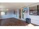 A spacious Florida room boasts wood flooring and waterfront views, perfect for relaxation at 4964 Cedarbrook Ln, Hernando Beach, FL 34607