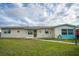 Charming single-story home with a well-maintained lawn and inviting front entrance at 4964 Cedarbrook Ln, Hernando Beach, FL 34607