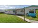 Charming single story home with a well maintained lawn and inviting walkway at 4964 Cedarbrook Ln, Hernando Beach, FL 34607