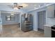 Kitchen boasts stainless steel appliances and ample counter space, seamlessly flowing into a dining area at 4964 Cedarbrook Ln, Hernando Beach, FL 34607