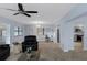 Bright and airy living room with views to the kitchen and outdoor features tile floors at 4964 Cedarbrook Ln, Hernando Beach, FL 34607