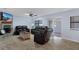Cozy living room with tile floors, comfortable seating, and a fireplace, perfect for relaxing at 4964 Cedarbrook Ln, Hernando Beach, FL 34607