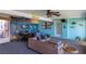 Inviting patio area with themed mural and comfortable seating, perfect for outdoor entertaining at 4964 Cedarbrook Ln, Hernando Beach, FL 34607