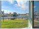 Waterfront view of canal houses seen from window, showcasing tranquil surroundings at 4964 Cedarbrook Ln, Hernando Beach, FL 34607