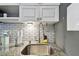 A stainless steel sink with modern fixtures is set into granite countertops in the kitchen at 6250 Vermont Ave, New Port Richey, FL 34653
