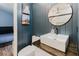 Chic powder room with modern fixtures, wood-look walls and decor at 7239 Sharpsburg Blvd, New Port Richey, FL 34653