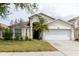 Charming single-Gathering home with a well-manicured lawn and attached two-car garage at 7239 Sharpsburg Blvd, New Port Richey, FL 34653