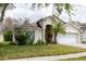 Charming single-Gathering home with a well-manicured lawn and attached two-car garage at 7239 Sharpsburg Blvd, New Port Richey, FL 34653