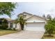 Charming single-Gathering home with a well-manicured lawn and attached two-car garage at 7239 Sharpsburg Blvd, New Port Richey, FL 34653