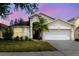 Charming single-Gathering home with a well-manicured lawn and attached two-car garage at 7239 Sharpsburg Blvd, New Port Richey, FL 34653