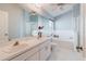 This main bathroom offers double sinks, and a tub and shower combination at 7239 Sharpsburg Blvd, New Port Richey, FL 34653