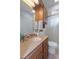 Bathroom featuring updated vanity, and a shower with sliding glass doors at 8133 Pagoda Dr, Spring Hill, FL 34606