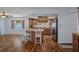Updated kitchen with stainless steel appliances, a decorative ceiling feature, and breakfast bar seating at 8133 Pagoda Dr, Spring Hill, FL 34606