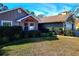 Charming home featuring updated windows, lush landscaping, and a well-maintained lawn at 8434 Hazelton St, Spring Hill, FL 34608