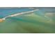 A scenic aerial view shows a road and bridge stretching across the ocean bay waters at 9 Forbes Pl # 512, Dunedin, FL 34698
